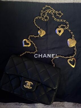 CHANEL Black Lambskin Quilted Mini Crossbody with Heart-Accent Gold Chain